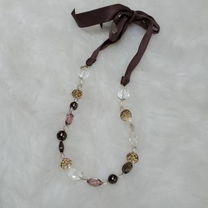 Big beaded necklace with ribbon tie